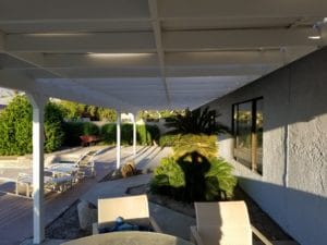 White pergola freshly painted white