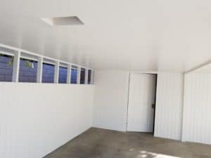 freshly painted white carport
