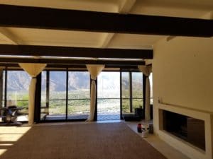 sunroom with painted ceiling and beams